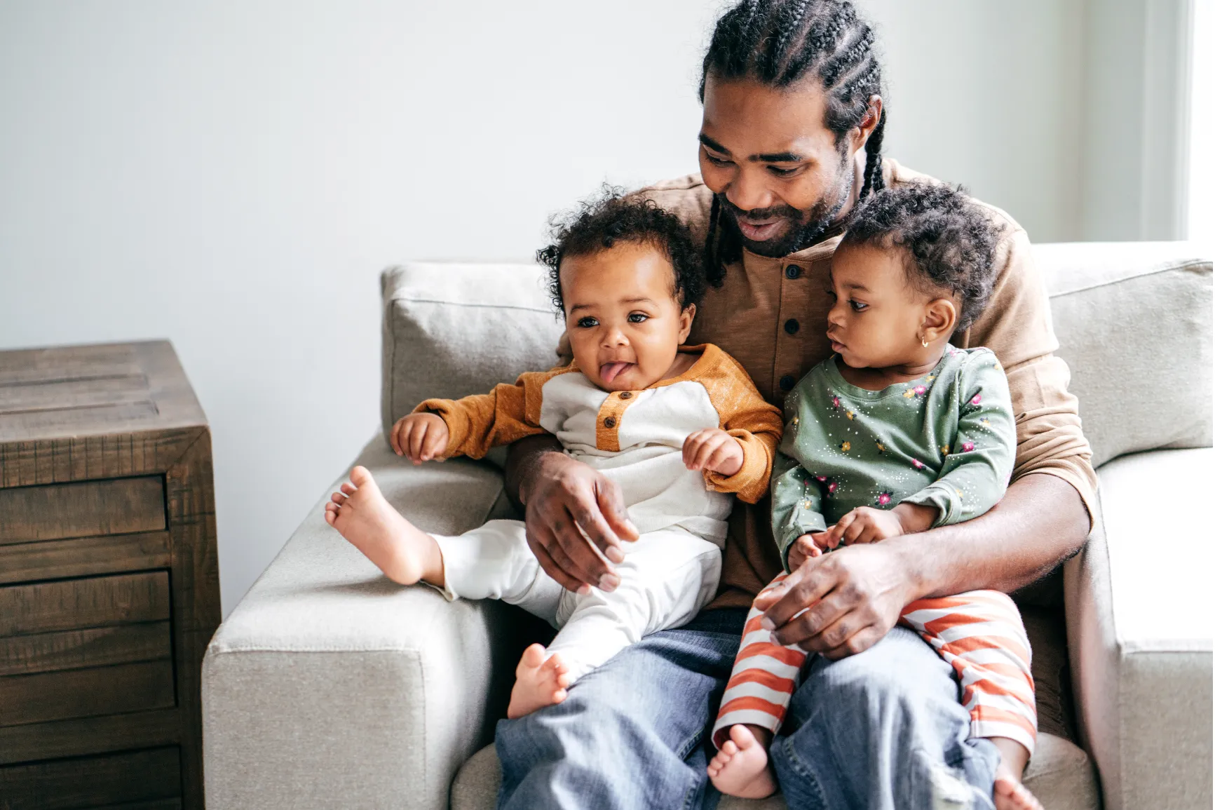 Father with two children on lap